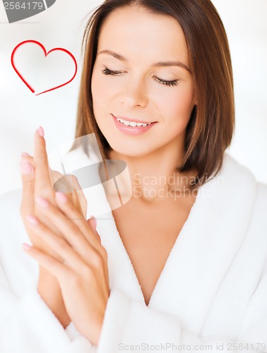 Image of beautiful woman in bathrobe