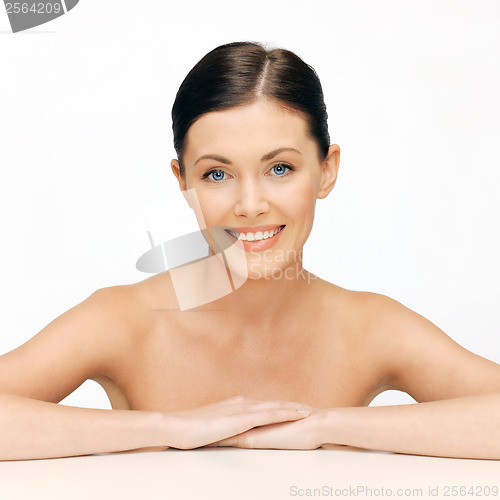 Image of face and hands of beautiful woman