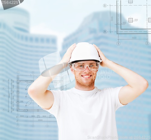 Image of male architect in white helmet with safety glasses