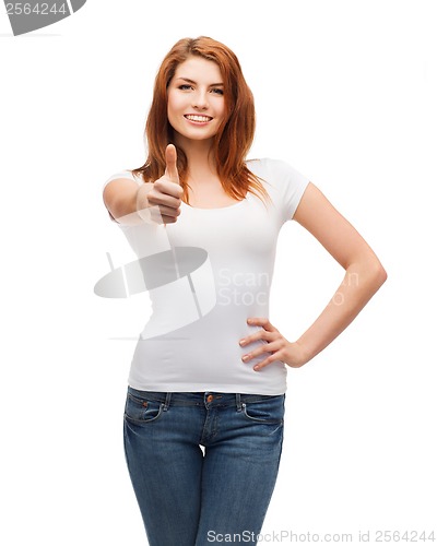 Image of teenager in white t-shirt showing thumbs up