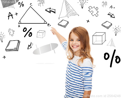 Image of girl pointing to triangle on virtual screen