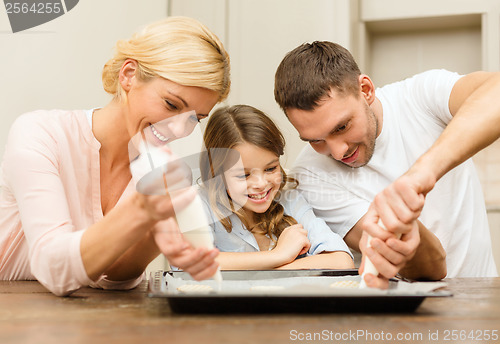 Image of happy family in making cookies at home