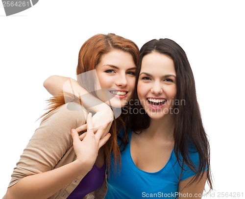 Image of two laughing girls hugging