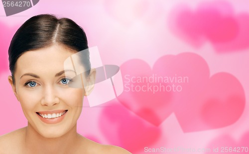 Image of face and hands of beautiful woman