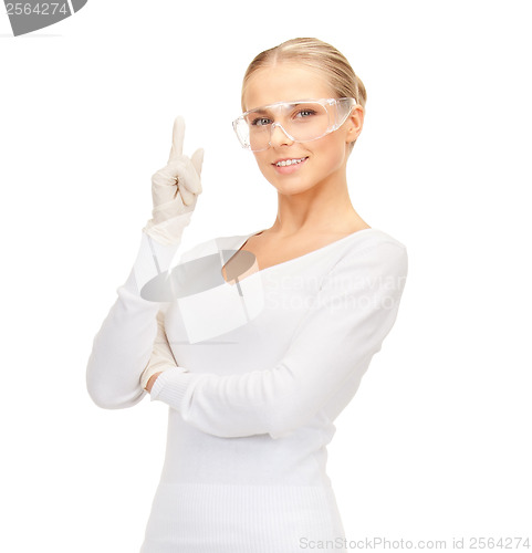 Image of woman in protective glasses and gloves