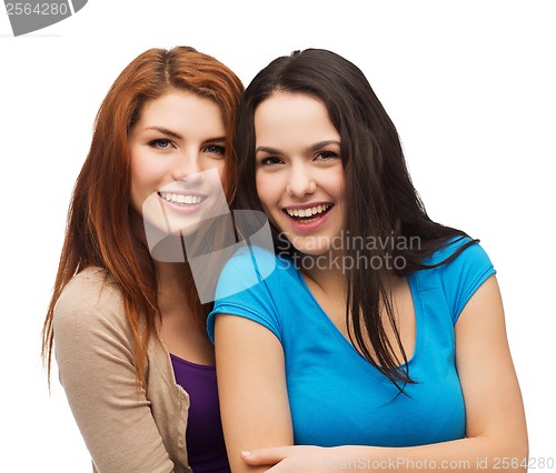 Image of two laughing girls hugging