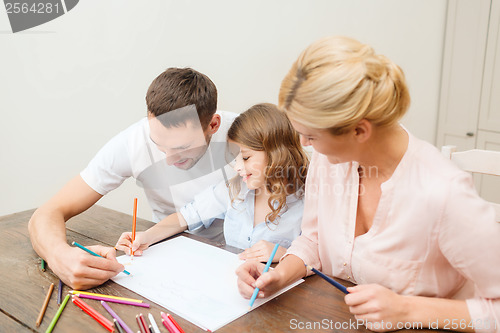 Image of happy family drawing at home