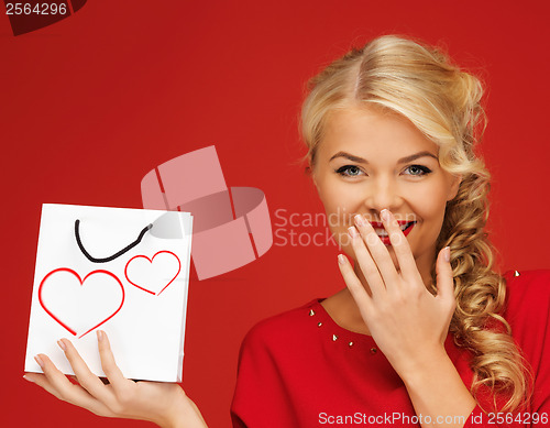 Image of lovely woman in red dress with shopping bag