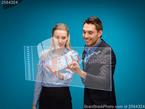 Image of woman and man working with forex chart