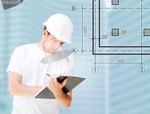 Image of male architect looking at blueprint