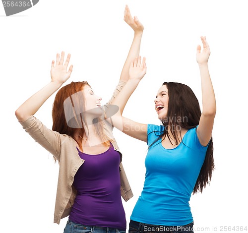 Image of two happy dancing girls