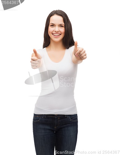 Image of teenager in white t-shirt showing thumbs up