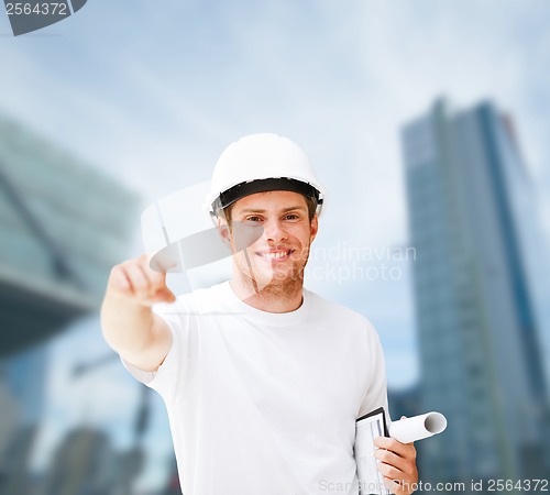 Image of male architect in helmet pointing at you