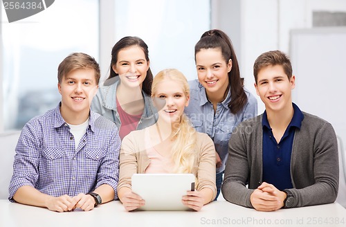 Image of smiling students with tablet pc at school