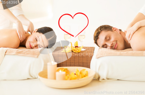 Image of couple getting massage in spa salon