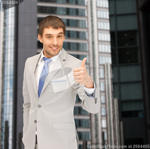 Image of handsome man with thumbs up