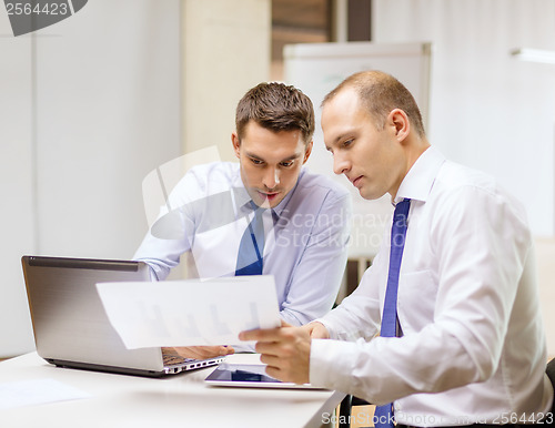 Image of two businessmen having discussion in office