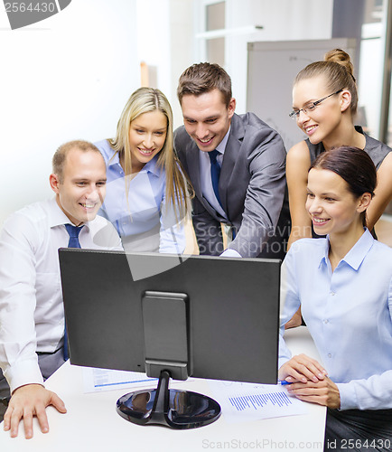 Image of business team with monitor having discussion