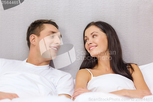 Image of happy couple sleeping in bed