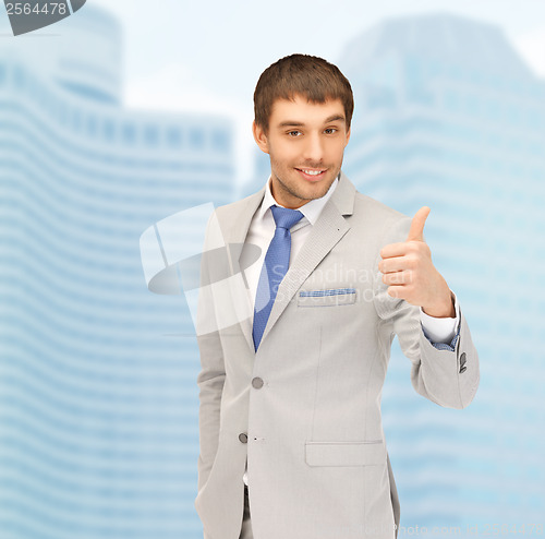 Image of handsome man with thumbs up