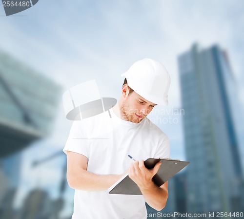 Image of male architect looking at blueprint