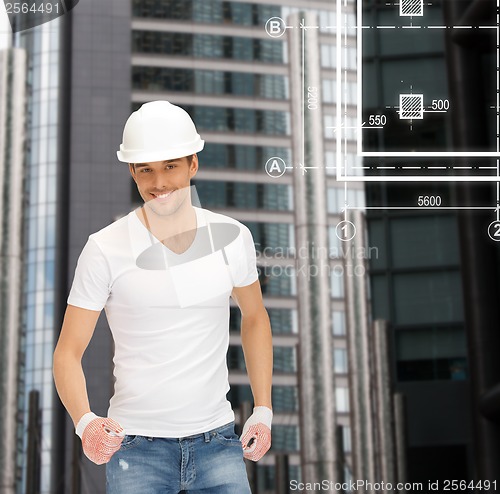 Image of handsome builder in white helmet