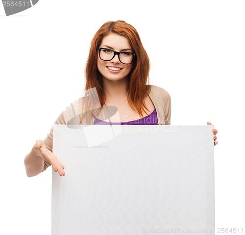 Image of smiling girl with eyeglasses and white blank board