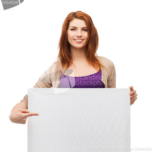 Image of smiling young girl with blank white board