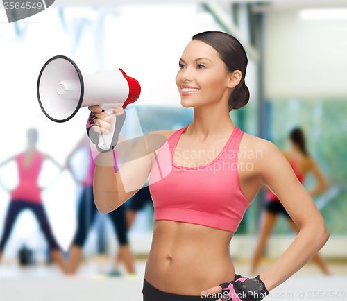 Image of smiling fit woman with megaphone