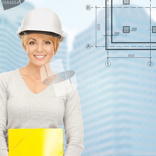 Image of female contractor in white helmet with files