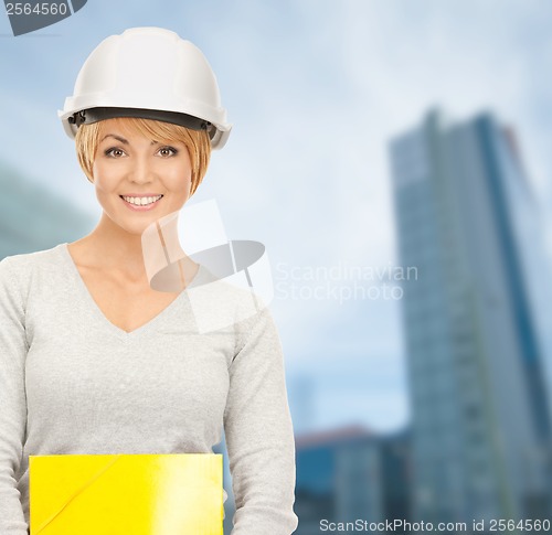 Image of female contractor in helmet with bluepring