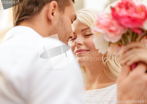 Image of couple with flowers in the city