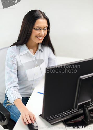 Image of smiling businesswoman or student with eyeglasses
