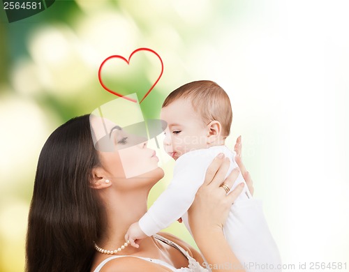 Image of happy mother kissing her child