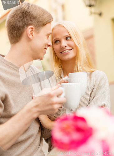 Image of romantic happy couple in the cafe