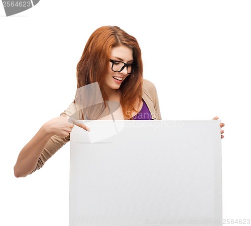 Image of smiling girl with eyeglasses and white blank board