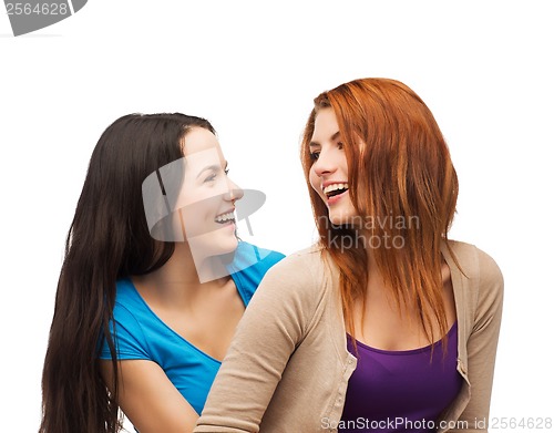 Image of two laughing girls looking at each other