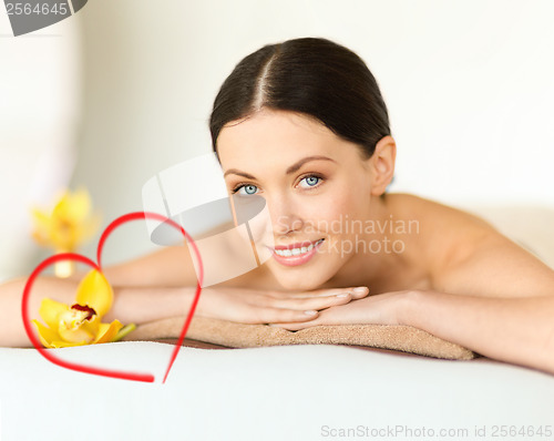 Image of smiling woman in spa salon