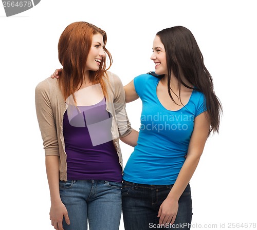 Image of two smiling girls looking at each other