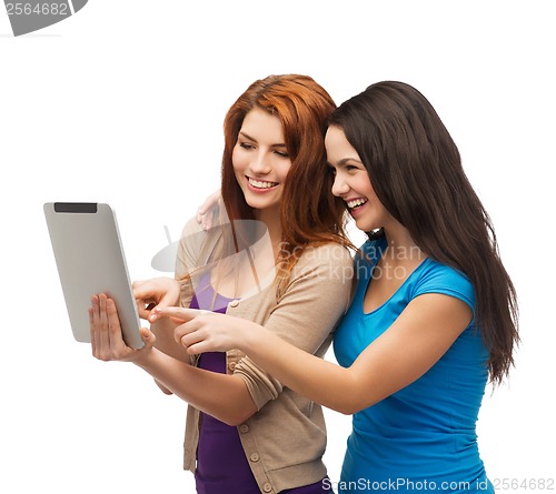 Image of two smiling teenagers with tablet pc computer