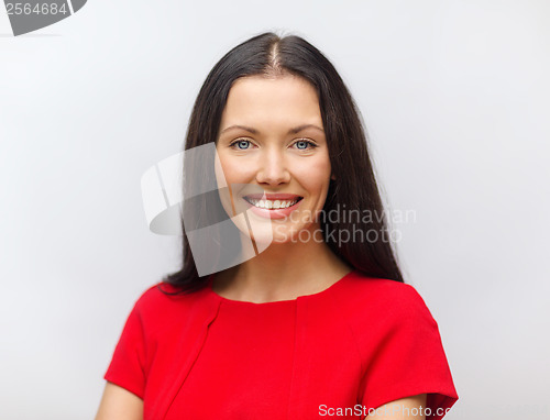 Image of smiling young woman in red dress