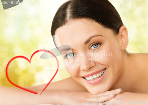 Image of beautiful smiling woman in spa salon