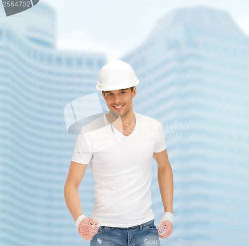Image of handsome builder in white helmet