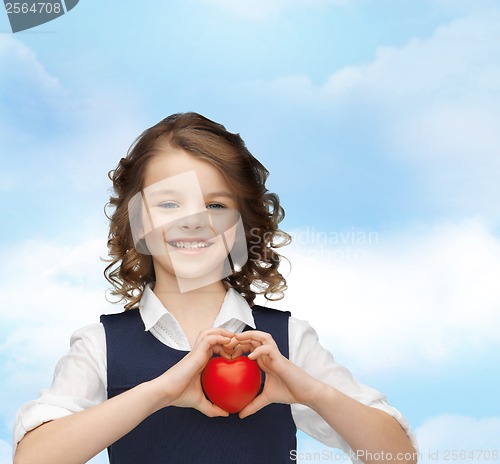 Image of beautiful girl with small heart