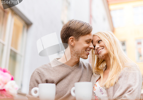 Image of romantic happy couple in the cafe