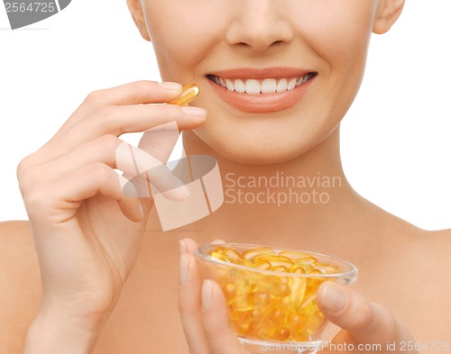 Image of beautiful woman with omega 3 vitamins