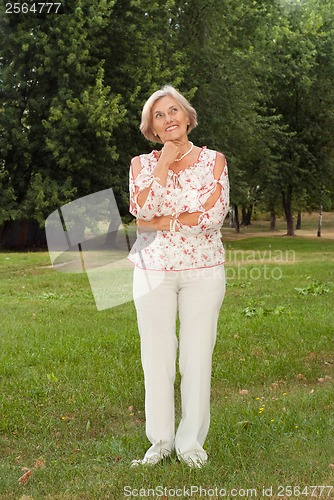 Image of Thoughtful elderly woman
