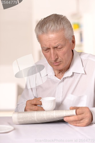 Image of Senior man with newspaper