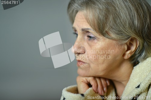 Image of Sad aged woman