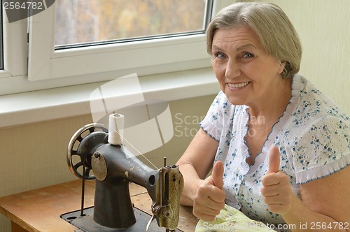 Image of woman at sewing machine